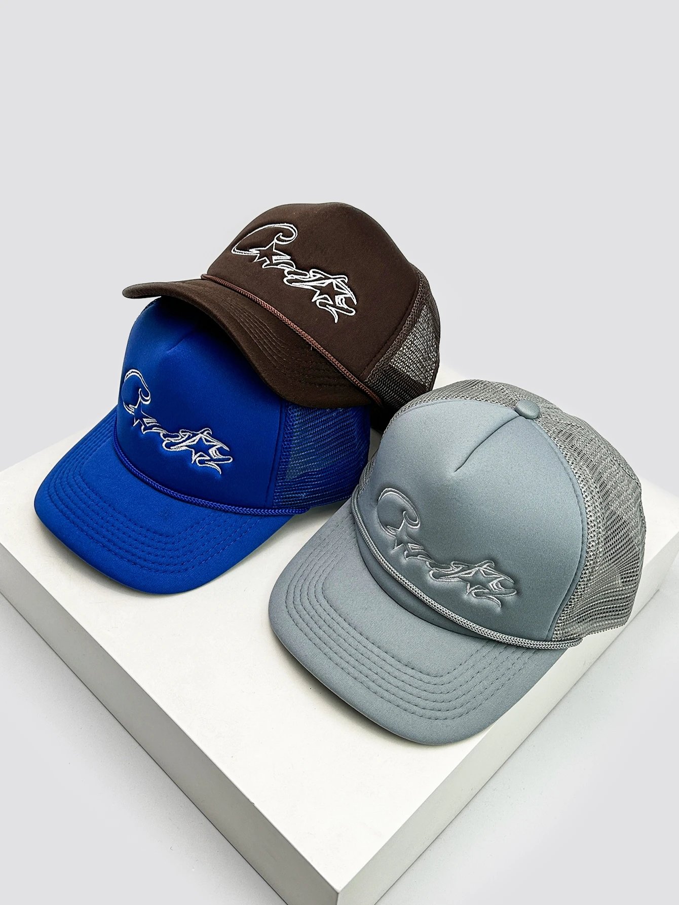 Trucker Hats with Embroidered Wave Design in Blue, Brown, and Grey